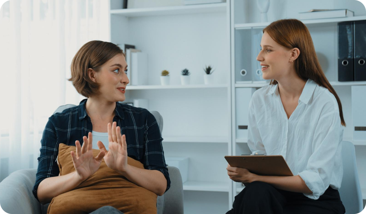 Two women engaged in conversation.